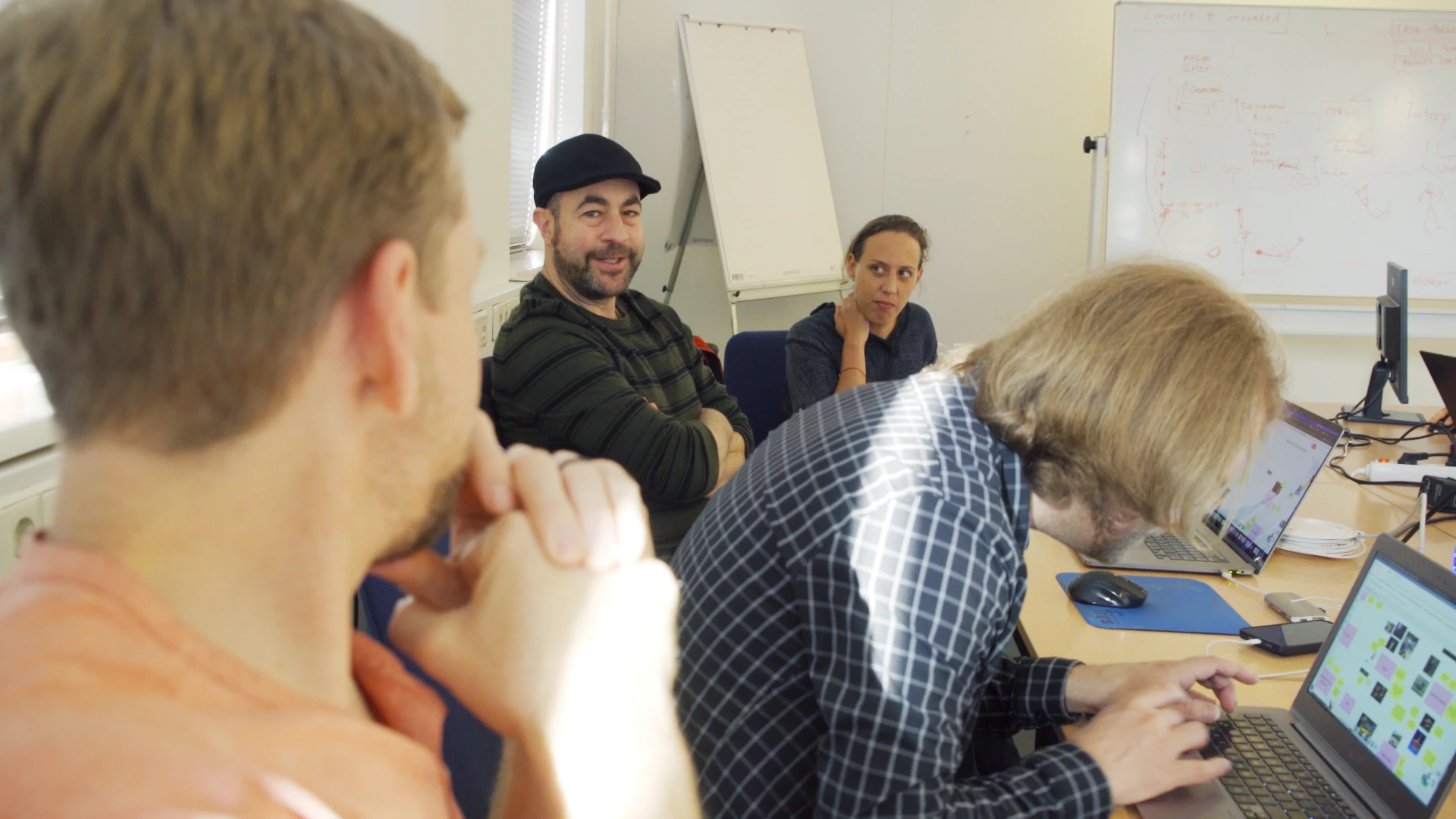 Four members of the Animation & Rigging module discussing ideas during the workshop.